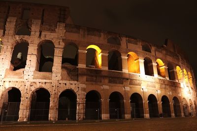 Low angle view of historical building at night