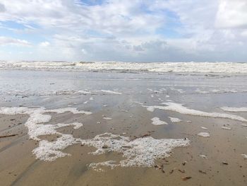 Scenic view of beach against sky