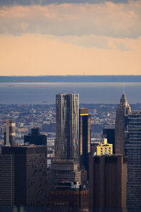 Cityscape against sky during sunset