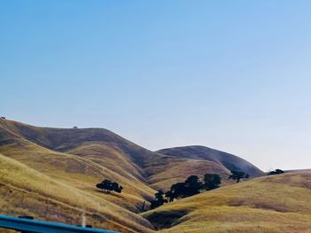 Scenic view of mountains against clear blue sky