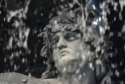 Close-up of statue against fountain