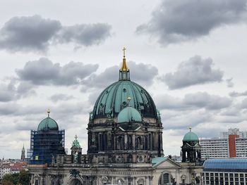 View of cathedral and buildings against sky