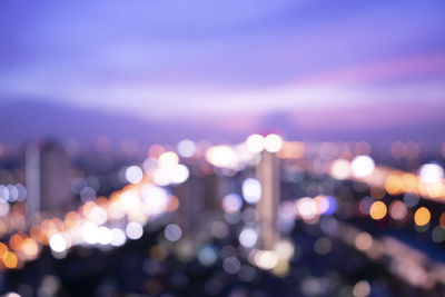 Defocused image of illuminated lights at night