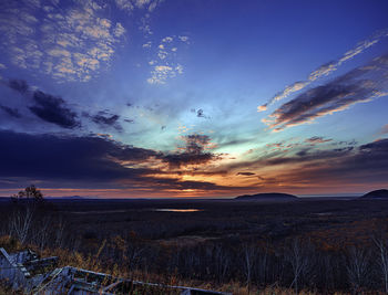 Scenic view of dramatic sky during sunset