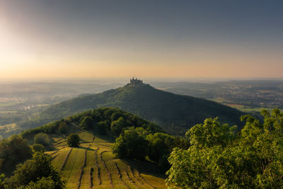 Scenic view of landscape against sky during sunset