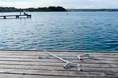 Pier over lake against sky