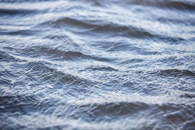 Full frame shot of sea with wave in background