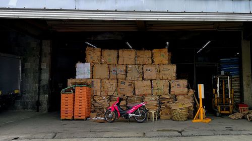 Man cycling on road by building