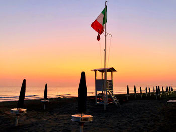 Scenic view of beach against sky during sunset