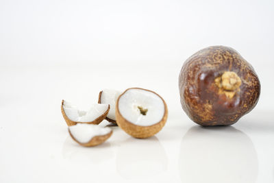 Close-up of fruits over white background