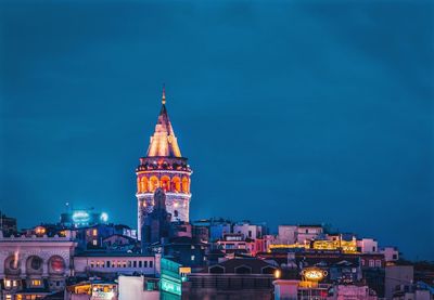 Illuminated cathedral against sky at night