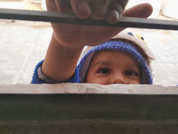 Portrait of boy peeking