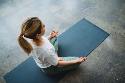 High angle view of woman meditating