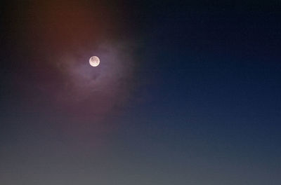 Low angle view of full moon in sky