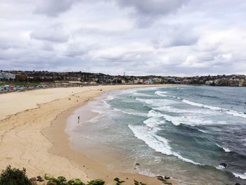 View of beach against cloudy sky