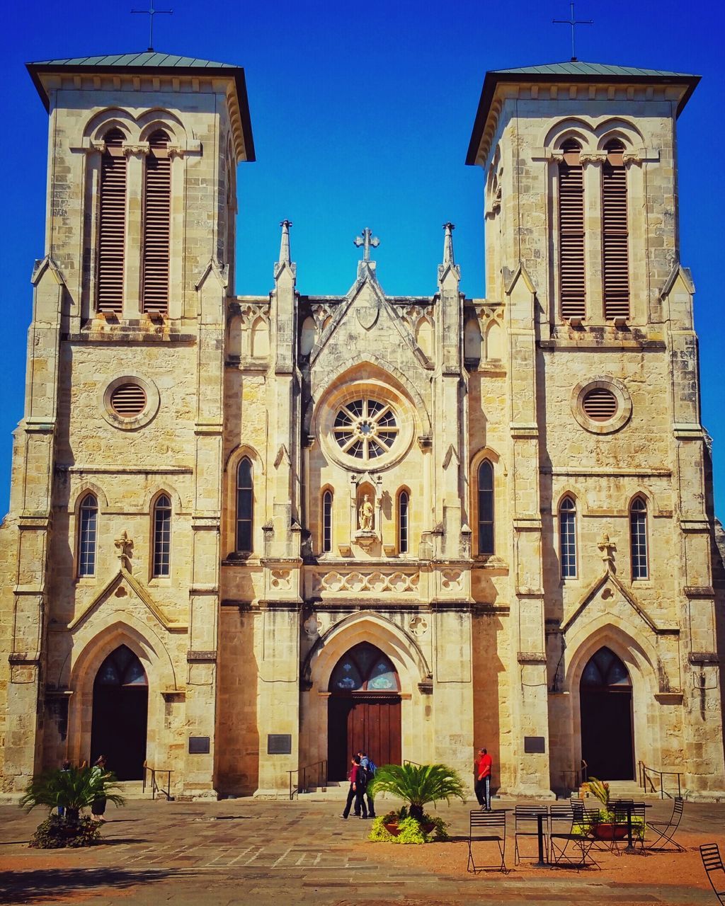 architecture, religion, building exterior, church, place of worship, built structure, spirituality, arch, facade, cathedral, low angle view, blue, clear sky, cross, travel destinations, history, famous place, travel