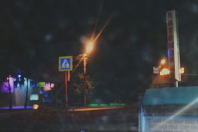 View of illuminated street at night