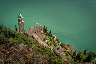 High angle view of a lake with a church at its borders