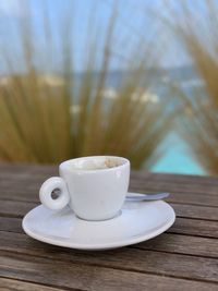 Close-up of coffee cup on table