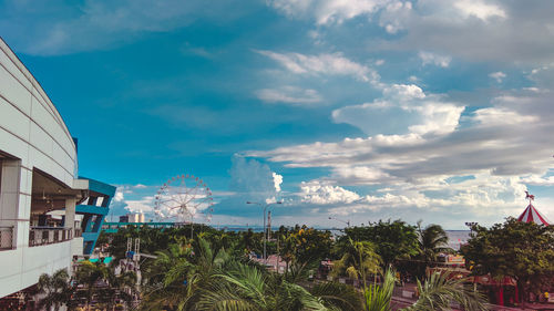 View of buildings against cloudy sky