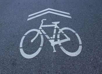 High angle view of bicycle lane sign on road