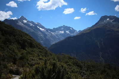 Scenic view of mountains against cloudy sky