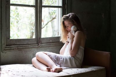 Woman sitting in window