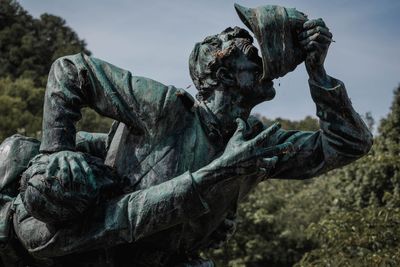 Close-up of statue against sky