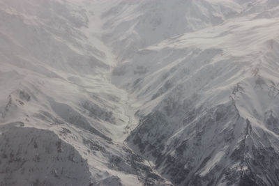 Full frame shot of snowcapped mountains during foggy weather at verbier