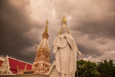 Low angle view of statue against sky