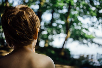 Rear view of shirtless woman