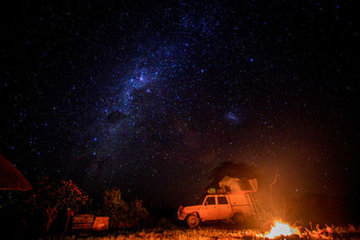 Campfire on field at night