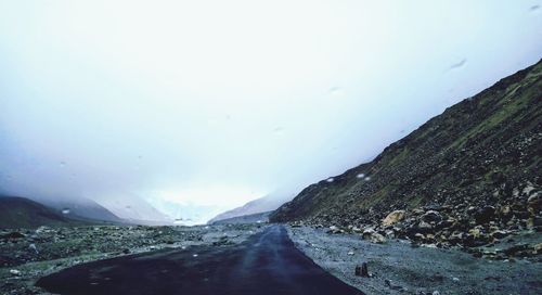 Road amidst landscape against sky