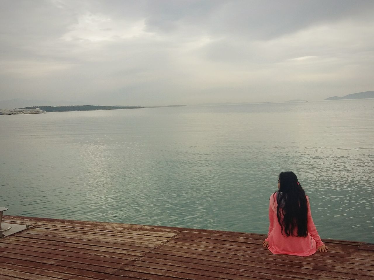 rear view, sea, water, full length, one person, women, real people, standing, sky, leisure activity, horizon over water, beauty in nature, outdoors, nature, cloud - sky, day, scenics, beach, one woman only, adult, people