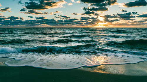 Scenic view of sea against sky during sunset