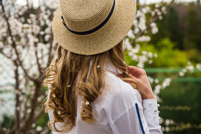Rear view of woman wearing hat