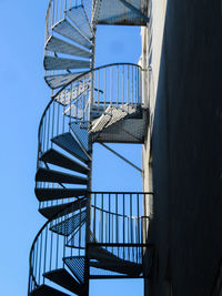 Low angle view of spiral staircase against sky