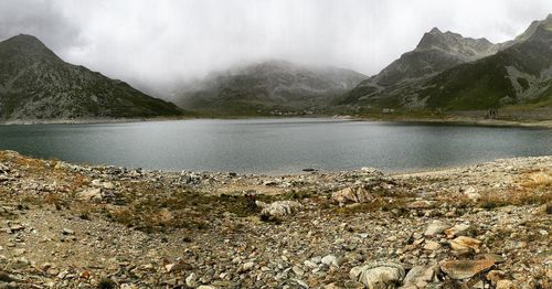 Scenic view of lake with mountains in background