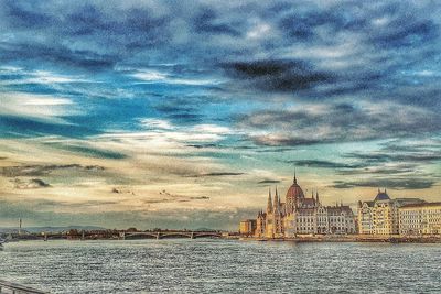 View of buildings against cloudy sky