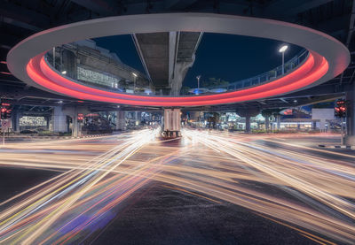 Light trails on road in city at night