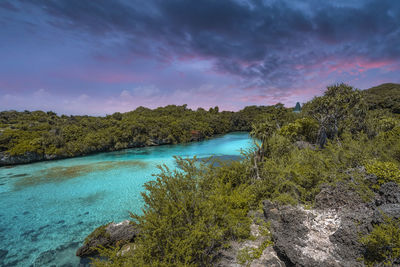 Scenic view of river against sky during sunset