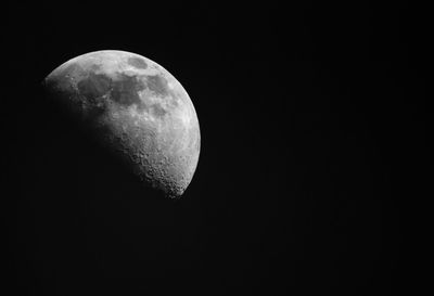 Low angle view of moon against sky at night