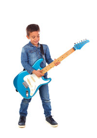 Full length of man playing guitar against white background