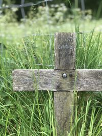 Close-up of wooden fence on field