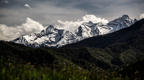 Scenic view of snowcapped mountains against sky