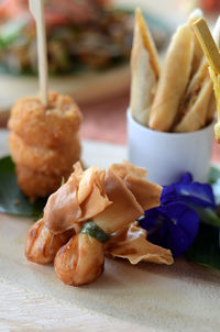 Close-up of serving food on table