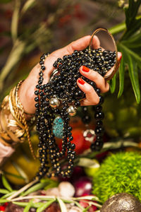 Midsection of woman holding fruit