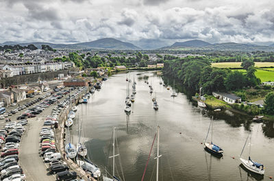 High angle view of river by cityscape against sky