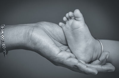 Cropped image of couple holding hands