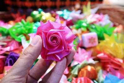 Close-up of hand holding rose bouquet